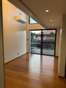 High-ceiling living area with natural light and modern interior design in Ayala Alabang Hills