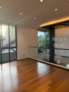 Bright upper hallway with floor-to-ceiling windows in Ayala Alabang luxury house